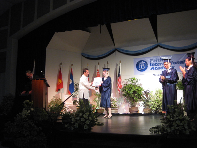 receiving diploma